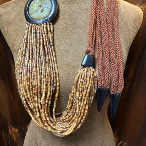 Rare Monies 36+ strand horn beads and Jade fish carving and wood.